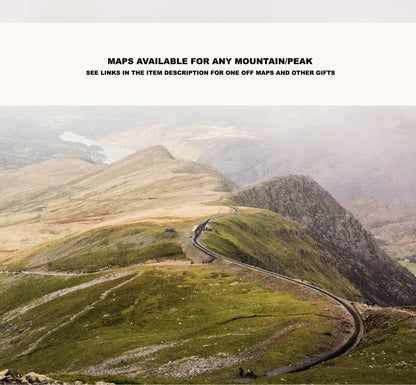 a scenic view of a winding road in the mountains